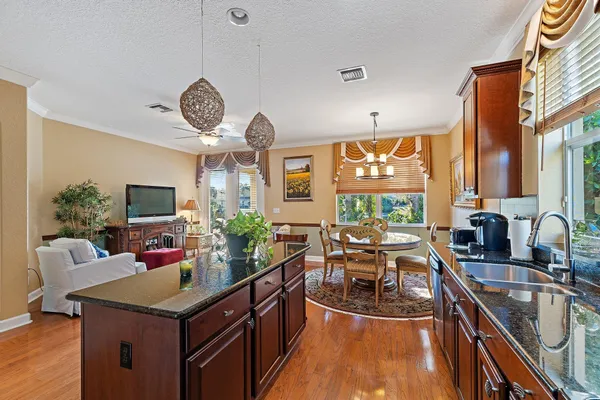 a view of a dining room with furniture window and outside view