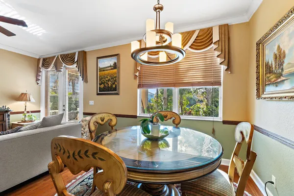 a view of a dining room with furniture window and outside view