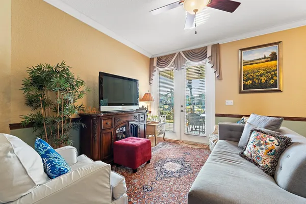 a living room with furniture and a flat screen tv