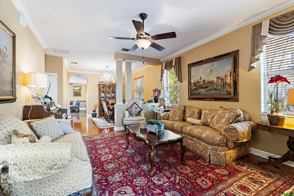 a view of a dining room with furniture and wooden floor