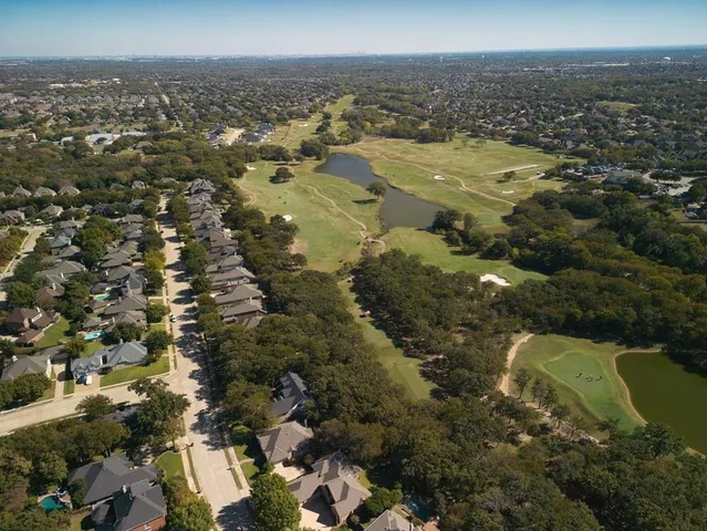 an aerial view of residential building and trees