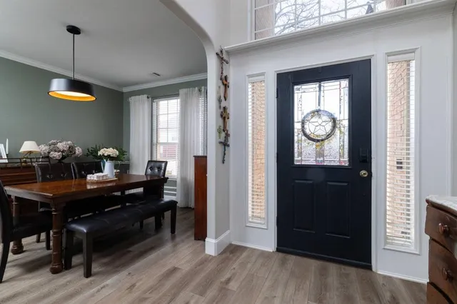 a view of a workspace and a window in a room