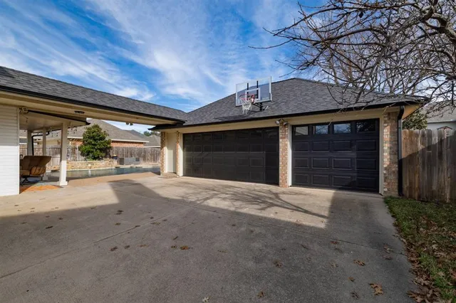 a view of a house with a yard and garage