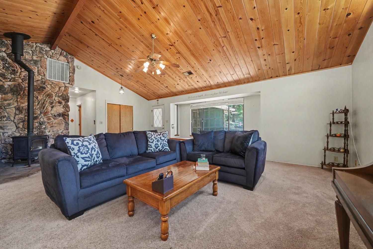 20310 State Rte 26 West Point, CA 95255 - Photo 10 of 57 a living room with furniture and a chandelier