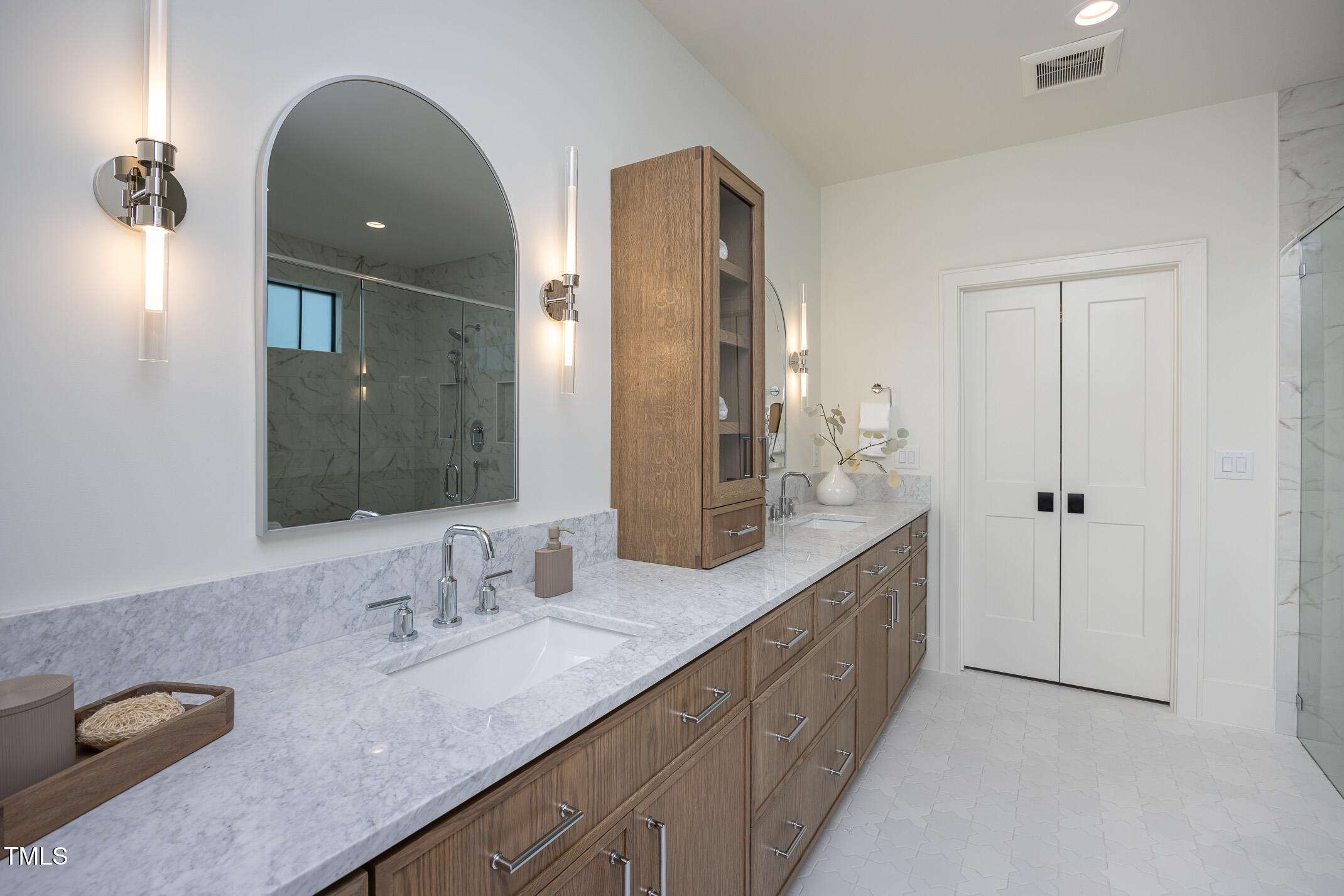1000 Marilyn Drive Raleigh, NC 27607 - Photo 34 of 59 Primary bathroom with double custom oak vanities.