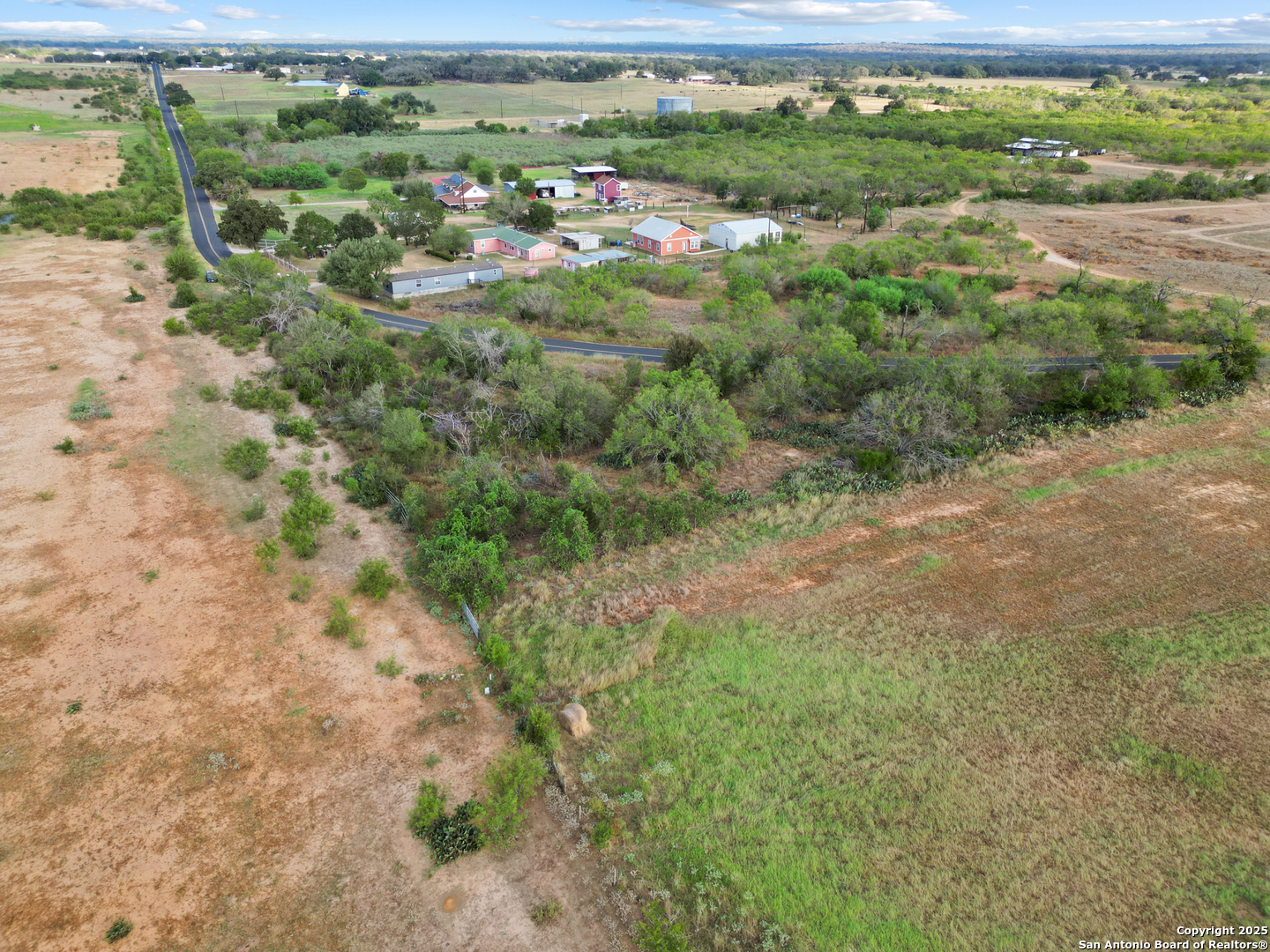 5835 Hardy Road Elmendorf, TX 78112 - Photo 3 of 8 a view of a green field