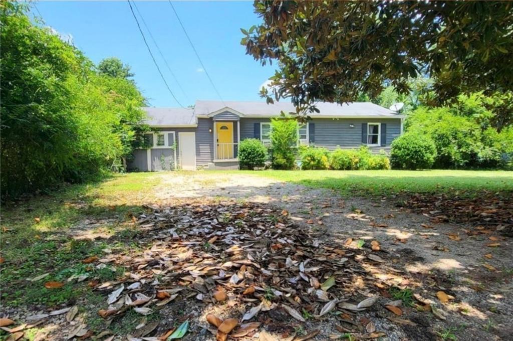 4148 Brenda Drive Decatur, GA 30035 - Photo 1 of 1 a front view of a house with a yard and trees