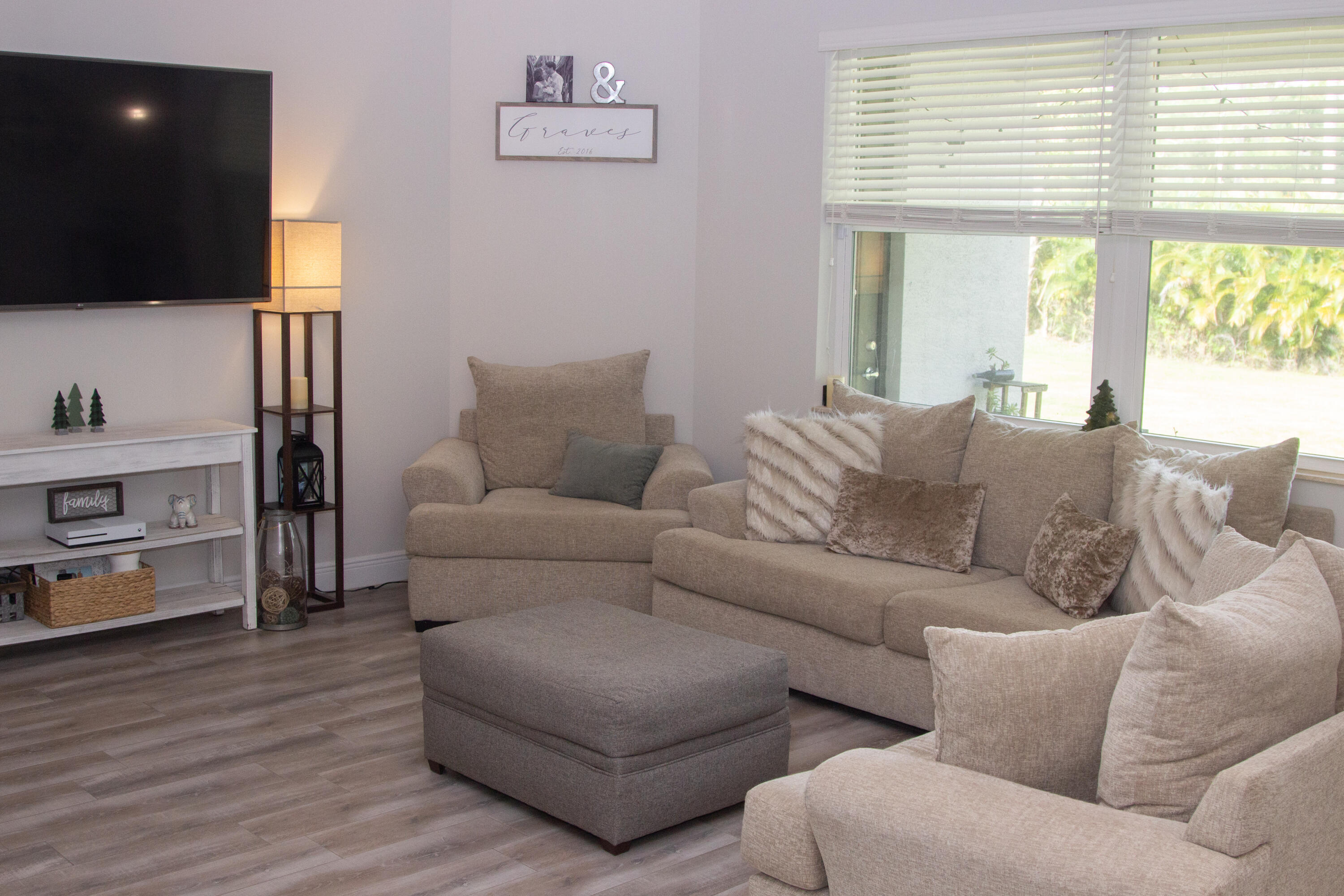 12601 57th Road North The Acreage, FL 33411 - Photo 6 of 24 a living room with furniture and a flat screen tv