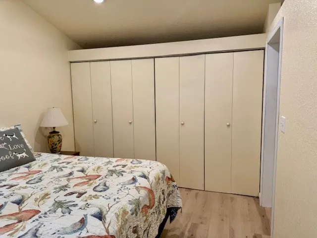 a bedroom with a bed and a curtain