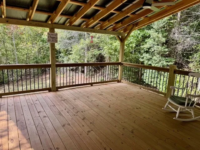 a view of balcony with wooden floor