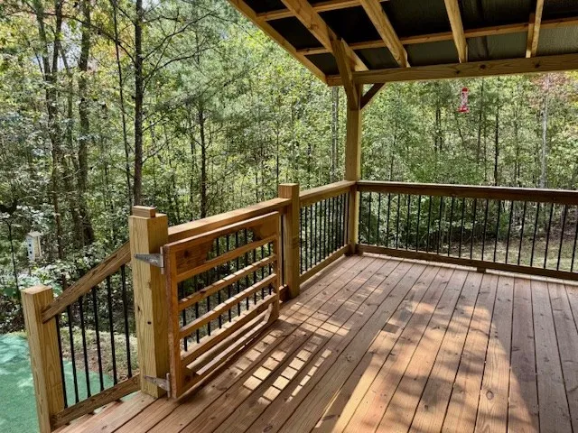 a view of balcony with wooden floor
