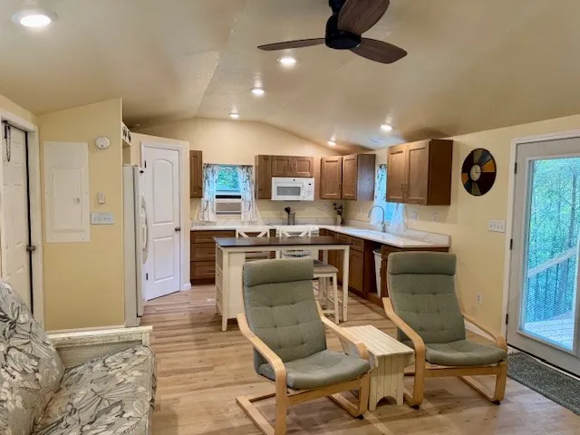 a kitchen with a refrigerator a sink and a stove