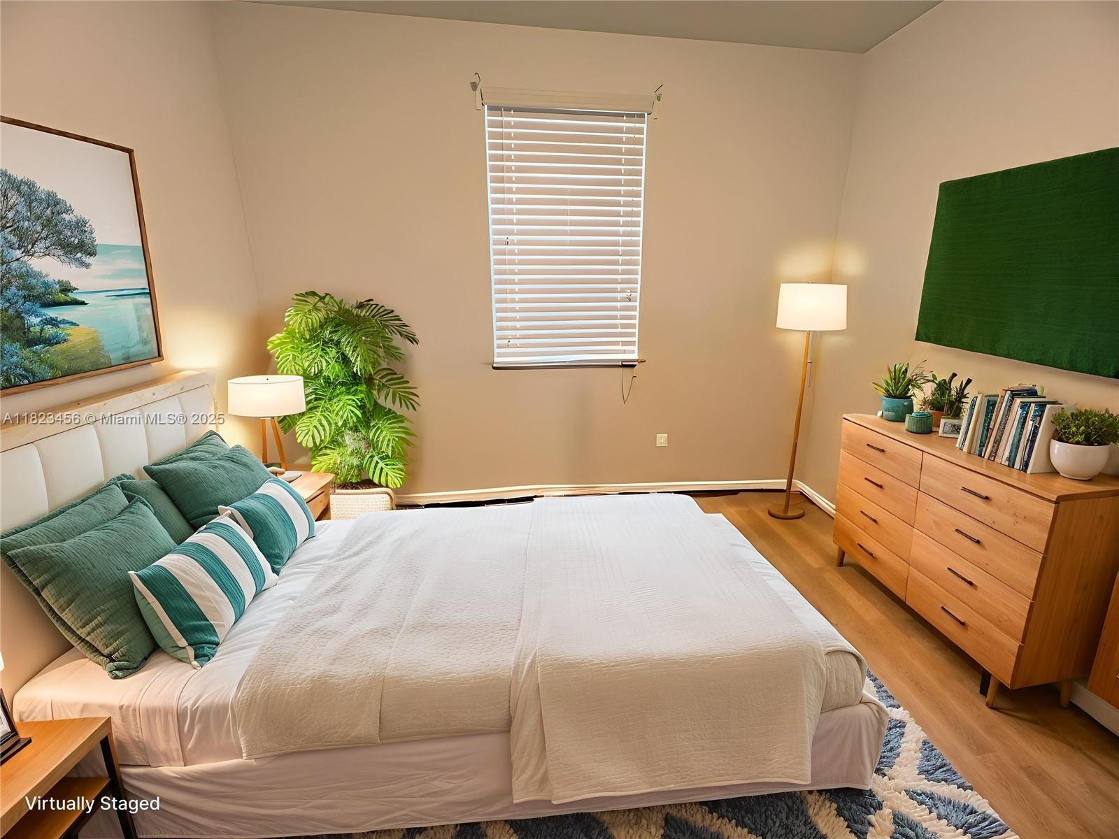 14745 Southwest 9th Street, Unit 3109 Pembroke Pines, FL 33027 - Photo 11 of 27 a bedroom with a bed mirror and window