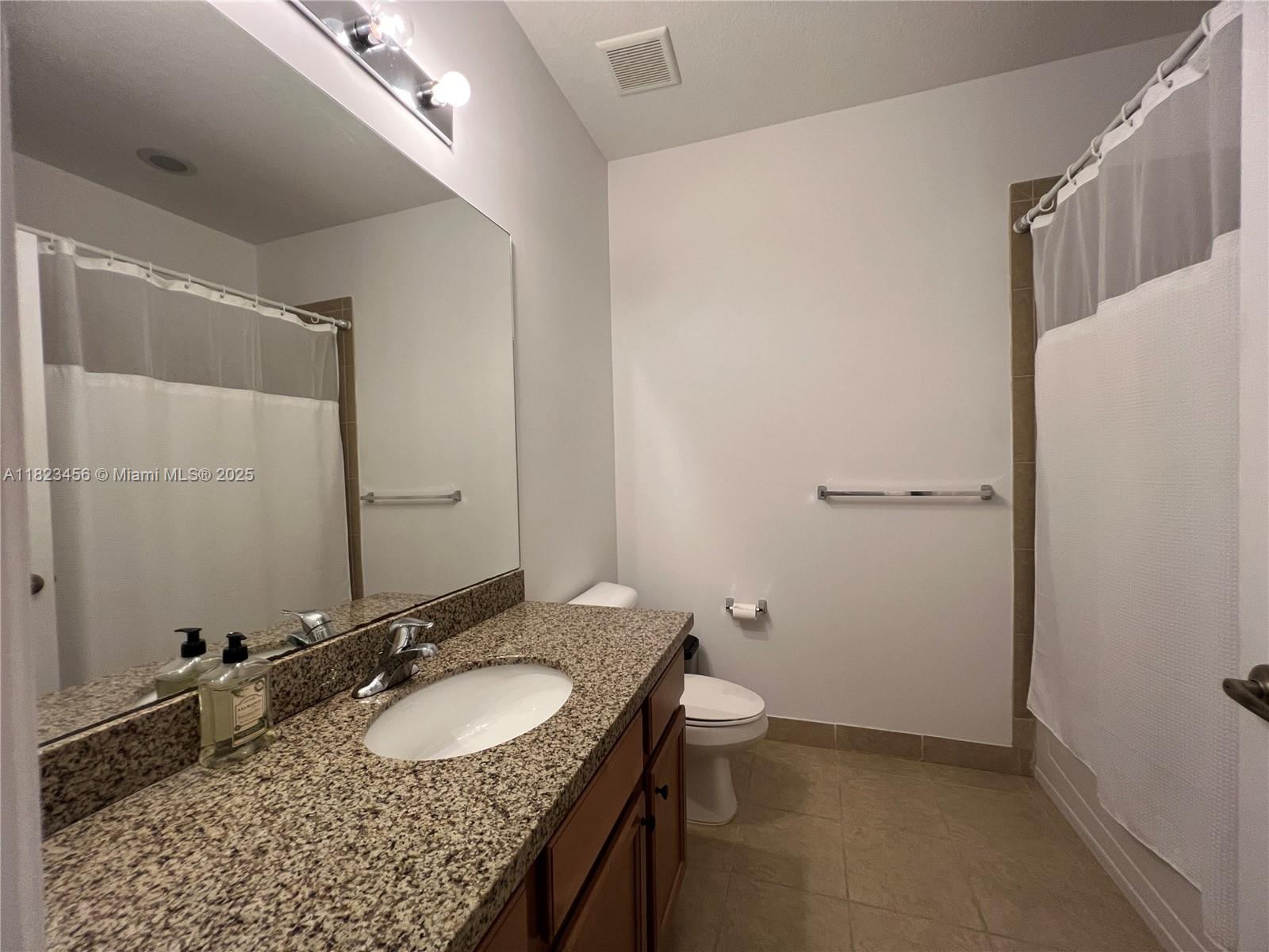 14745 Southwest 9th Street, Unit 3109 Pembroke Pines, FL 33027 - Photo 12 of 27 a bathroom with a sink and a mirror