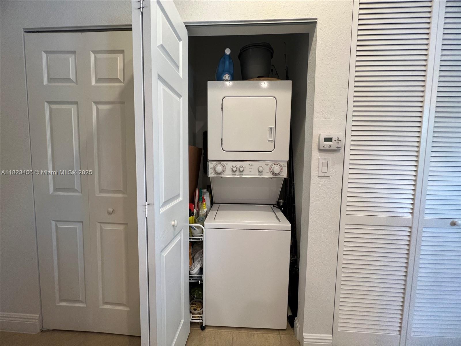 14745 Southwest 9th Street, Unit 3109 Pembroke Pines, FL 33027 - Photo 14 of 27 a utility room with dryer and washer