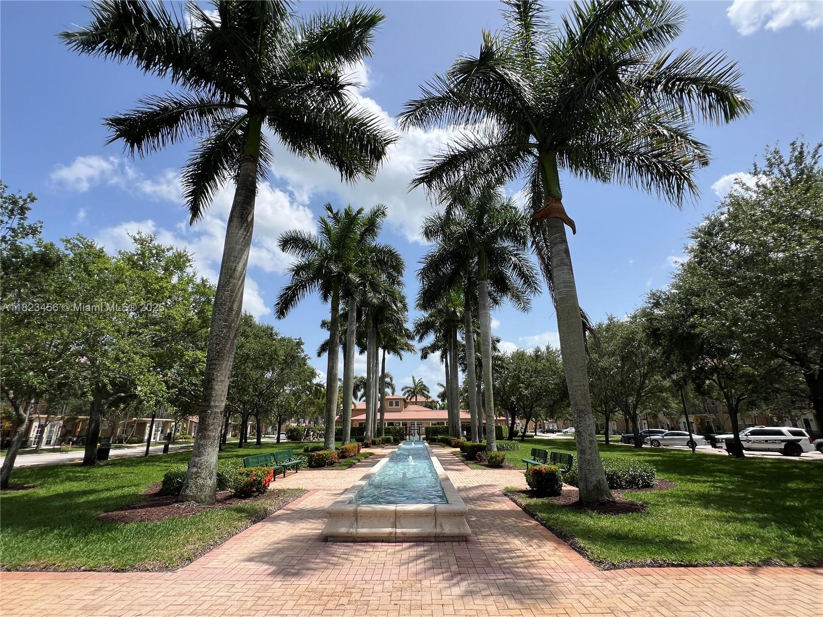 14745 Southwest 9th Street, Unit 3109 Pembroke Pines, FL 33027 - Photo 18 of 27 a park with palm trees