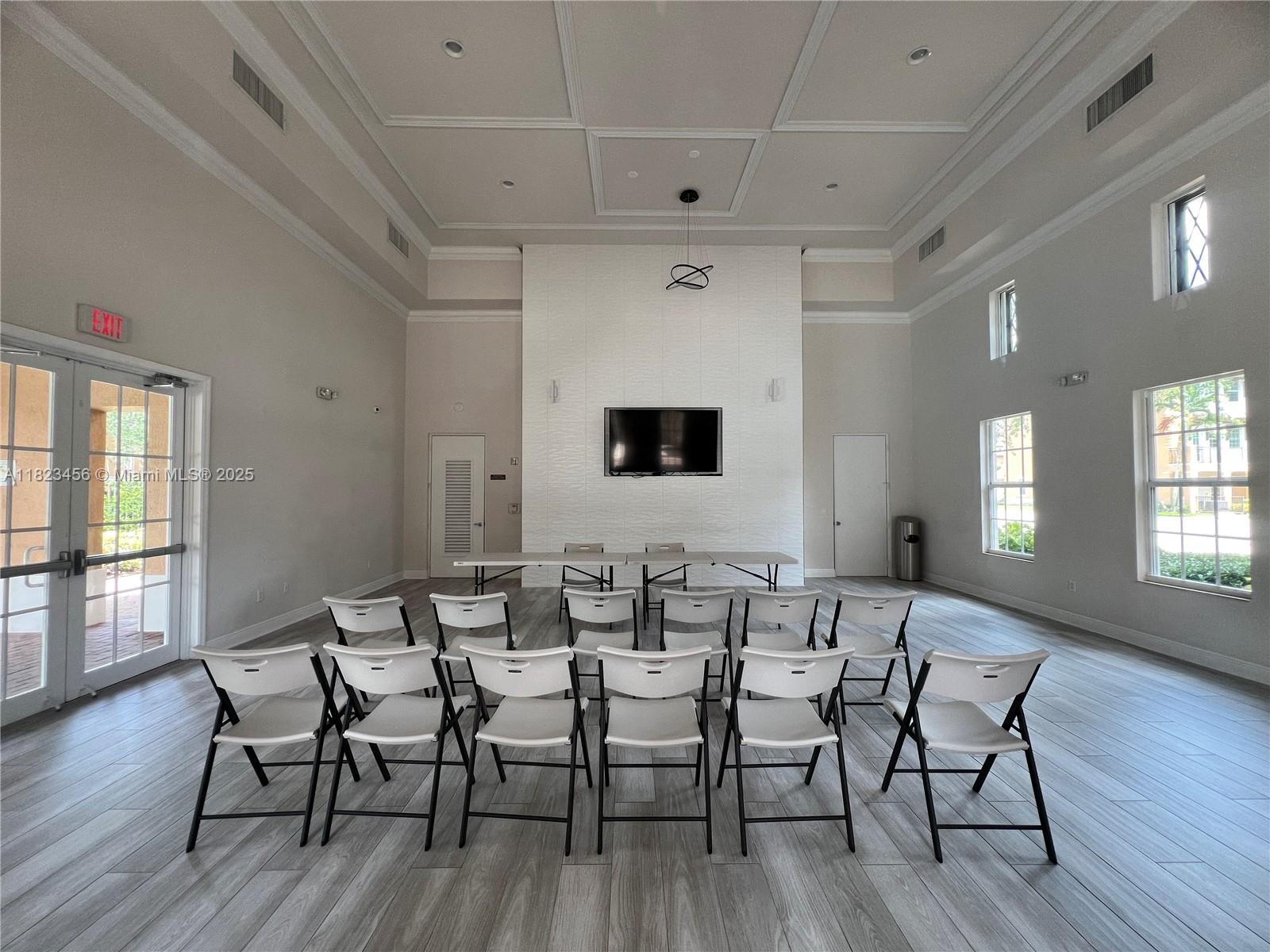 14745 Southwest 9th Street, Unit 3109 Pembroke Pines, FL 33027 - Photo 21 of 27 a view of a dining room with furniture and wooden floor