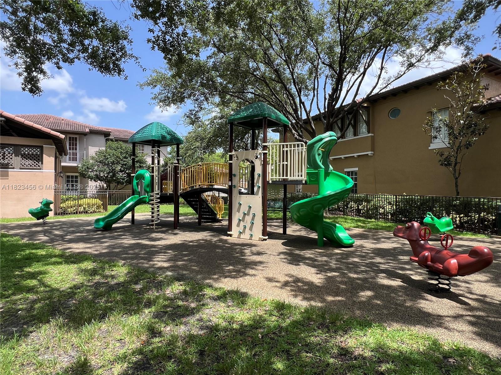 14745 Southwest 9th Street, Unit 3109 Pembroke Pines, FL 33027 - Photo 25 of 27 a view of a house with backyard and a tree