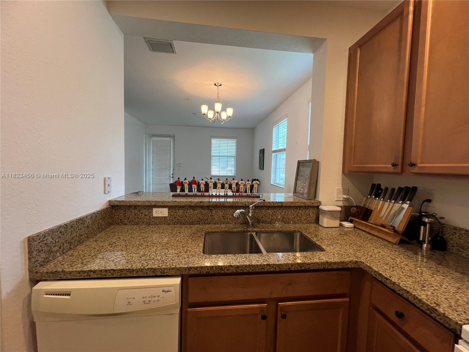 14745 Southwest 9th Street, Unit 3109 Pembroke Pines, FL 33027 - Photo 5 of 27 a kitchen with sink and cabinets