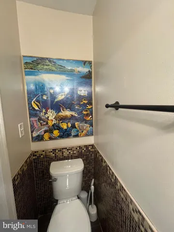 a view of a backyard with couches and a table and chairs