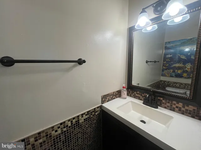 a view of a backyard with wooden fence