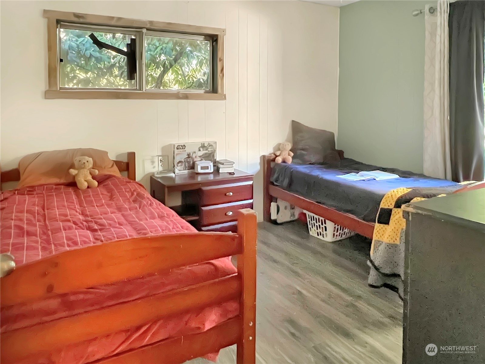 502 Kroll Road Castle Rock, WA 98611 - Photo 21 of 30 a bedroom with a bed and wooden floor