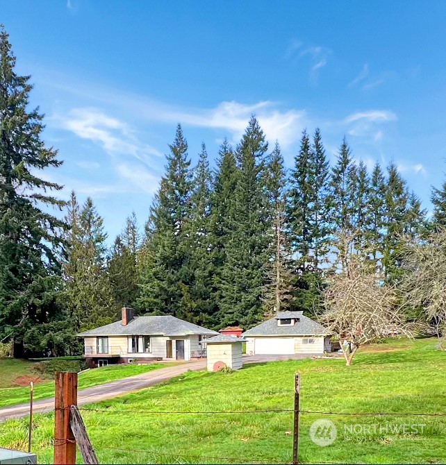502 Kroll Road Castle Rock, WA 98611 - Photo 29 of 30 a view of an house with backyard space and balcony