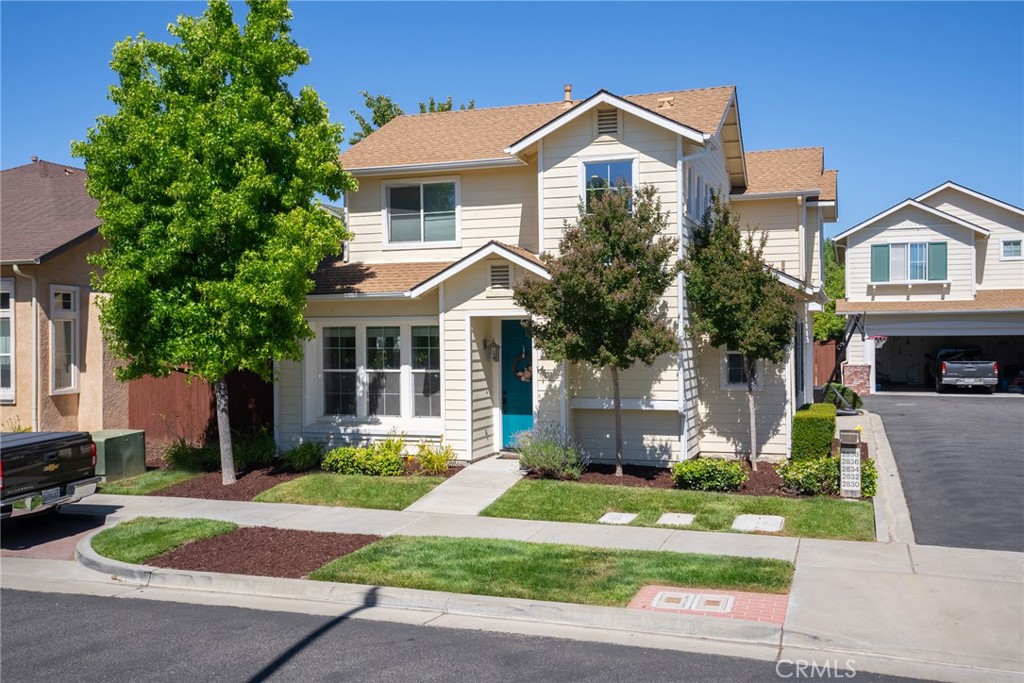 2838 Cottage Lane Paso Robles, CA 93446 - Photo 2 of 29 a front view of a house with garden and trees