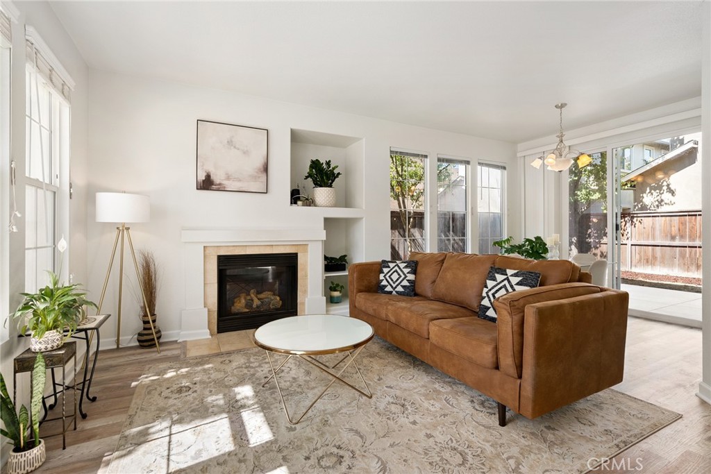 2838 Cottage Lane Paso Robles, CA 93446 - Photo 6 of 29 a living room with furniture a large window and a fireplace