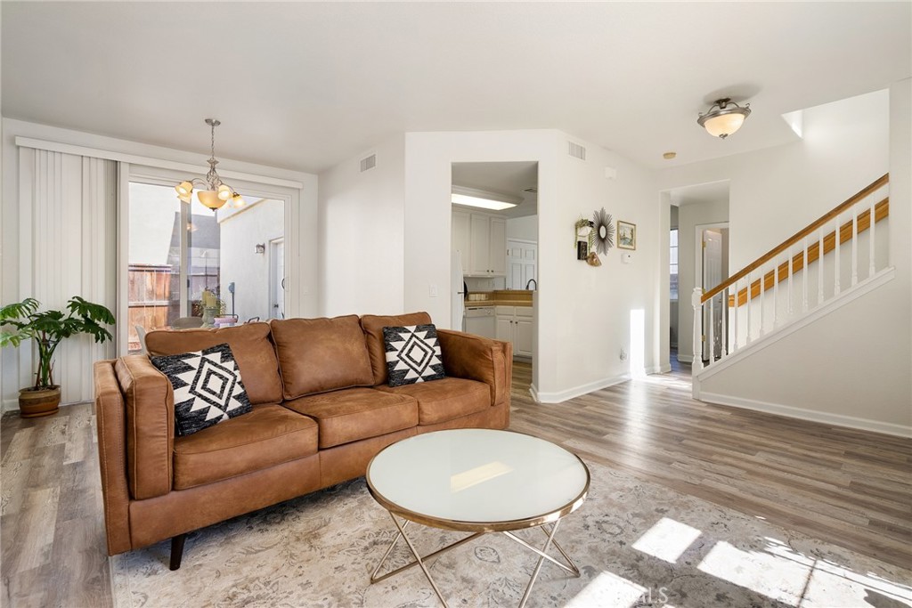 2838 Cottage Lane Paso Robles, CA 93446 - Photo 7 of 29 a living room with furniture a dining table and a chandelier