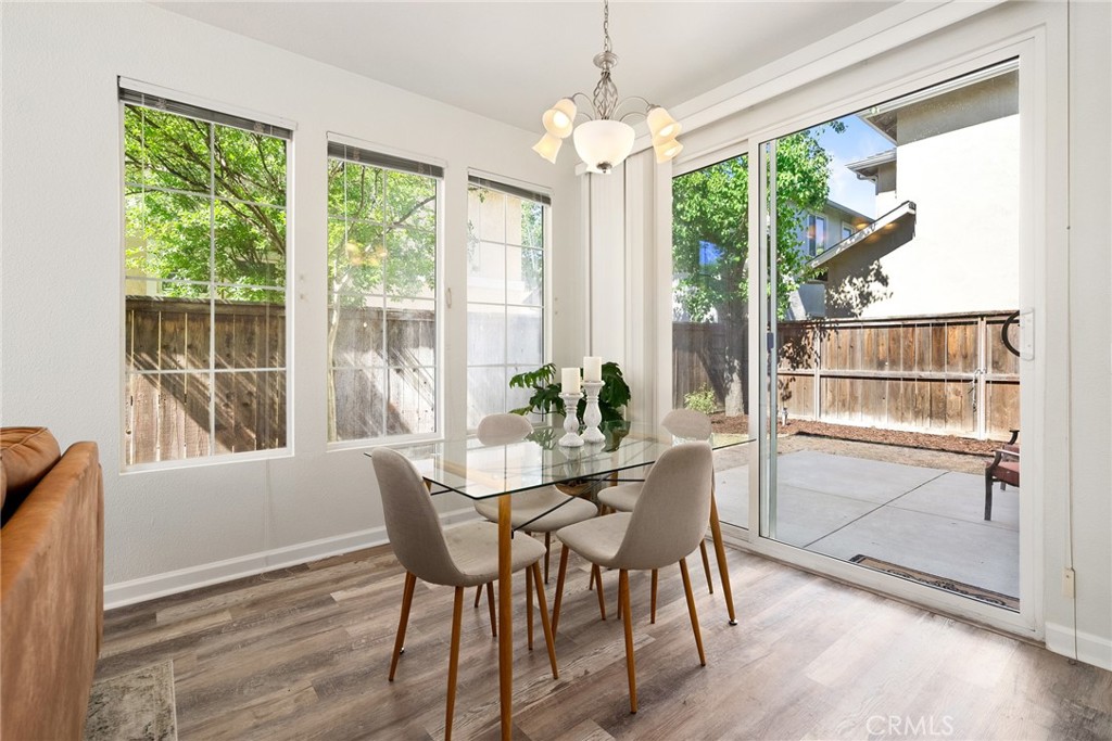2838 Cottage Lane Paso Robles, CA 93446 - Photo 8 of 29 a view of a dining room with furniture window and wooden floor