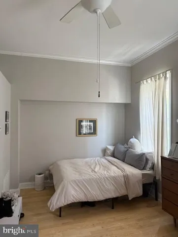 a bedroom with a bed and window