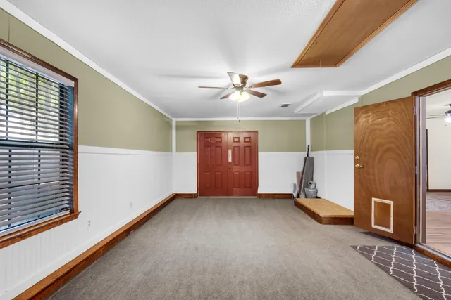 a view of an empty room with a window