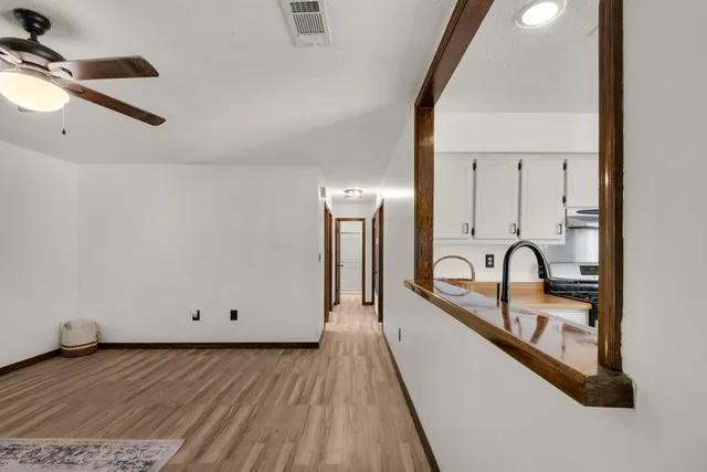 a view of a living room with hardwood floor