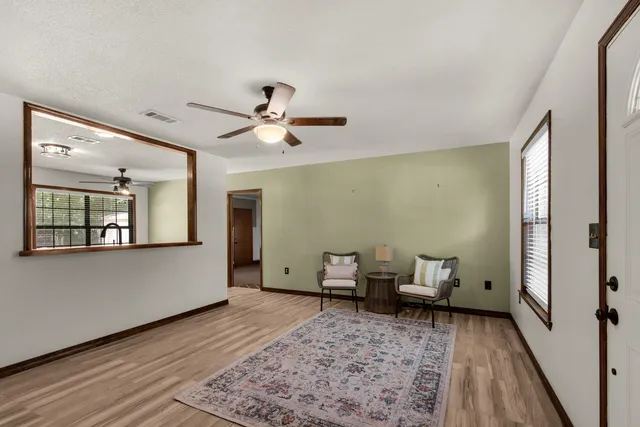 a living room with furniture and a rug