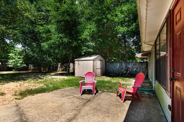 a house view with a sitting space and garden