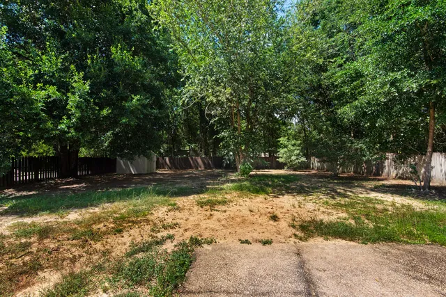 a view of a house with a tree