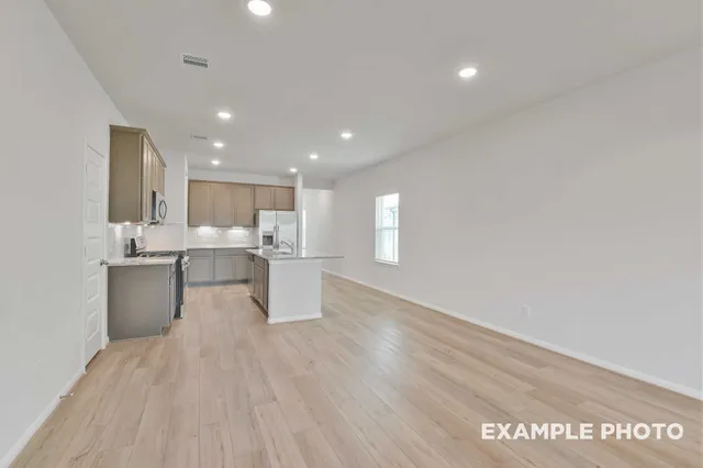 a view of kitchen with wooden floor