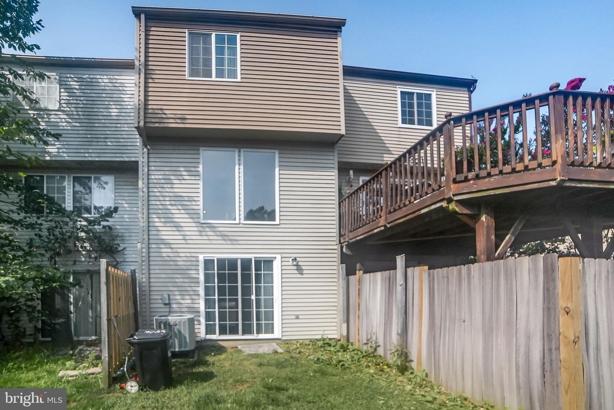 3650 Castle Terrace, Unit 11112 Silver Spring, MD 20904 - Photo 16 of 26 a view of balcony with deck and outdoor seating
