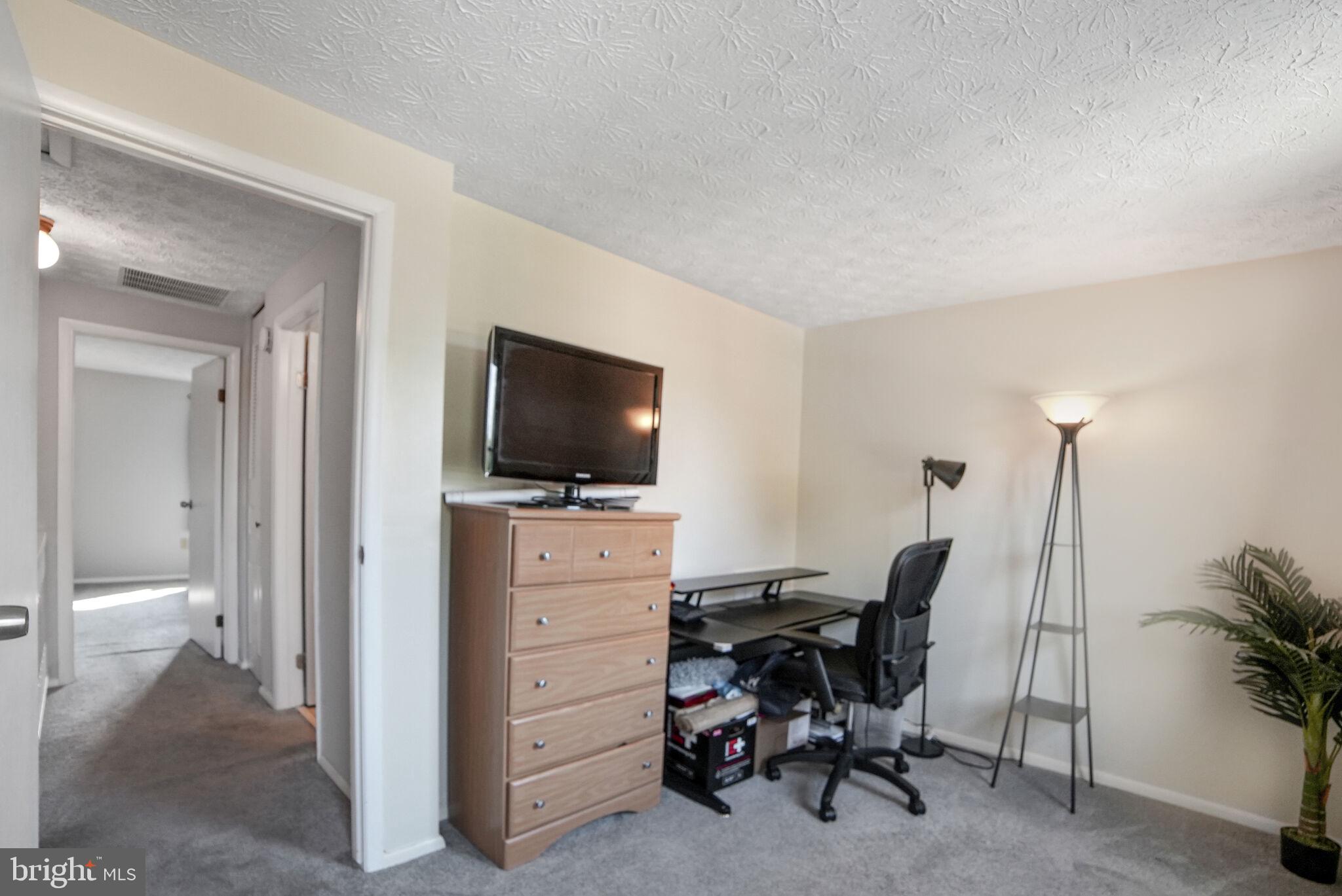 3650 Castle Terrace, Unit 11112 Silver Spring, MD 20904 - Photo 8 of 26 a view of a livingroom with a flat screen tv