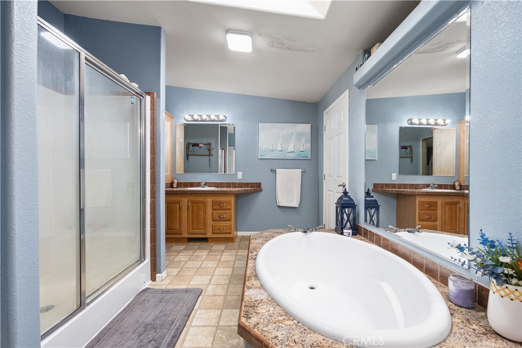 42100 Buckeye Street Caliente, CA 93518 - Photo 12 of 64 a bathroom with a tub sink and mirror