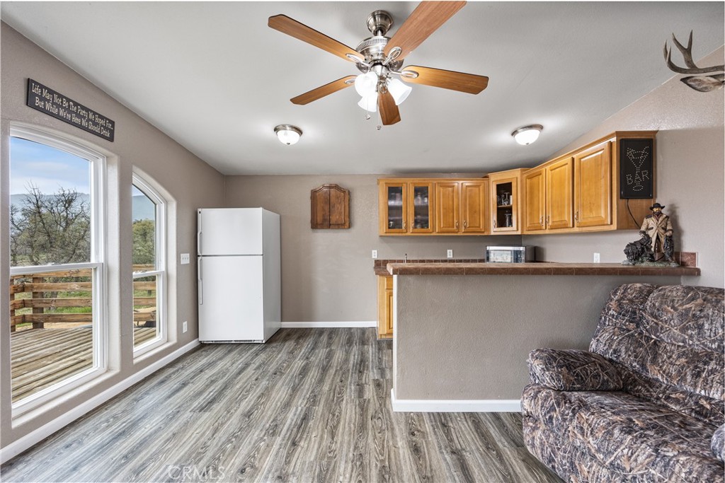 42100 Buckeye Street Caliente, CA 93518 - Photo 37 of 64 a kitchen with stainless steel appliances granite countertop a refrigerator a stove and a wooden floors