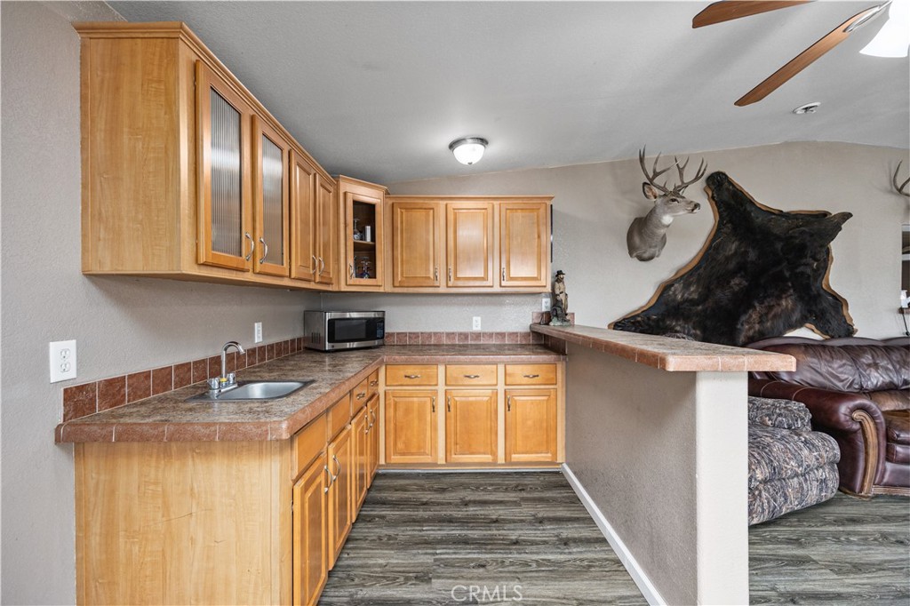 42100 Buckeye Street Caliente, CA 93518 - Photo 38 of 64 a kitchen with stainless steel appliances granite countertop a sink and cabinets