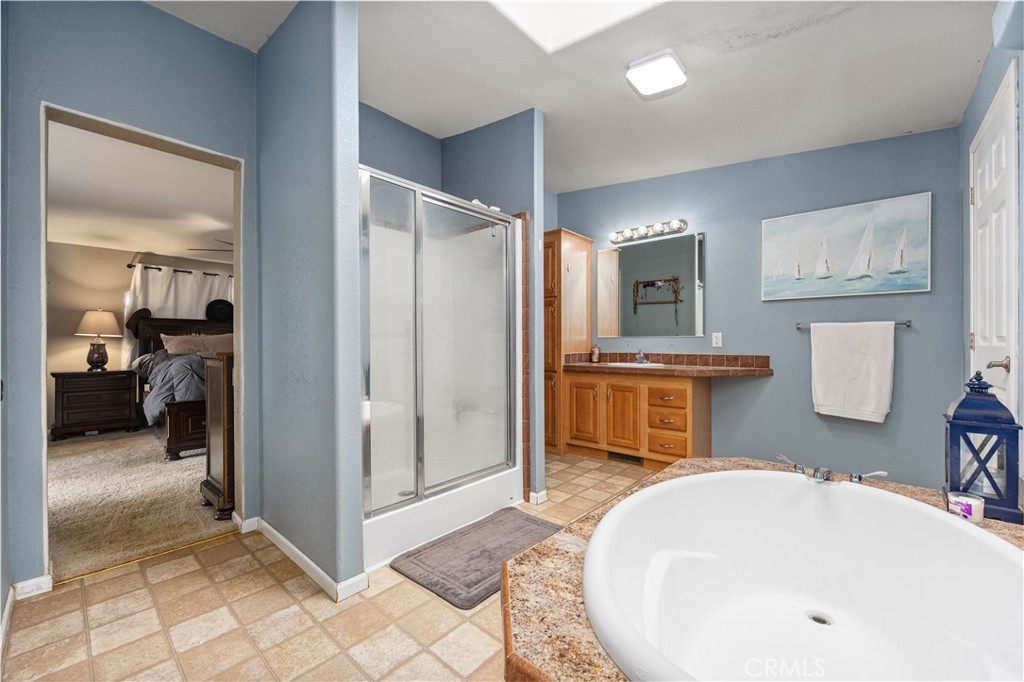 42100 Buckeye Street Caliente, CA 93518 - Photo 42 of 64 a bathroom with a sink a mirror and a shower