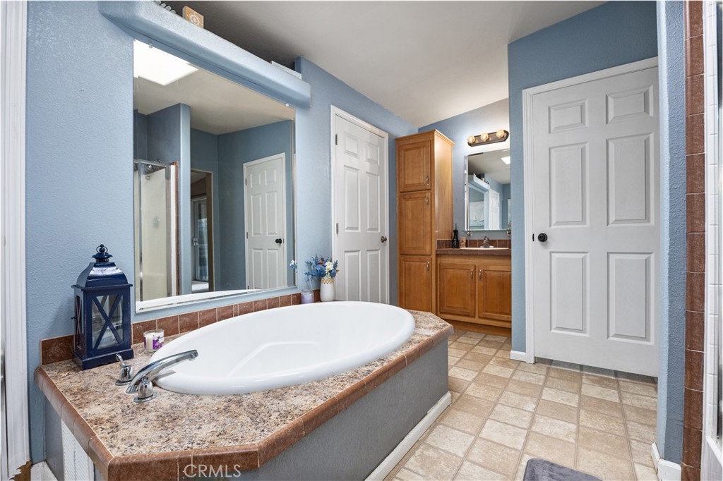 42100 Buckeye Street Caliente, CA 93518 - Photo 44 of 64 a bathroom with a granite countertop sink and a mirror