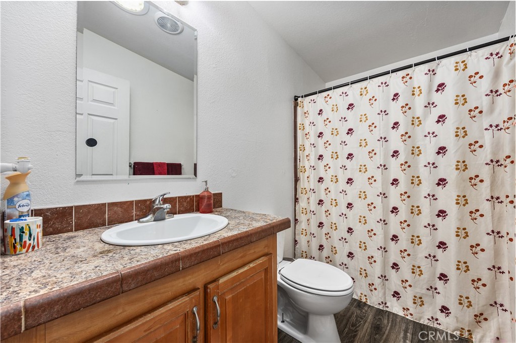 42100 Buckeye Street Caliente, CA 93518 - Photo 48 of 64 a bathroom with a sink toilet and a mirror