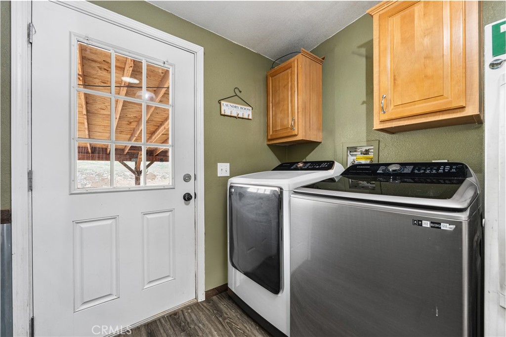 42100 Buckeye Street Caliente, CA 93518 - Photo 50 of 64 a utility room with wooden floor washer and dryer