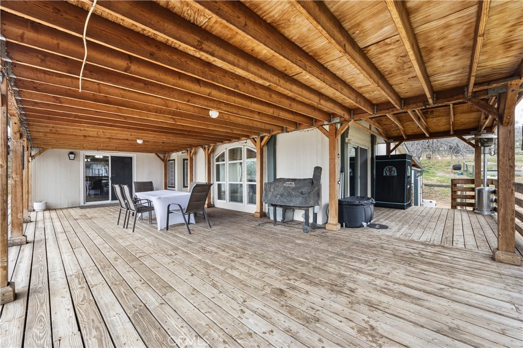 42100 Buckeye Street Caliente, CA 93518 - Photo 54 of 64 a view of a roof deck with table and chairs with wooden floor