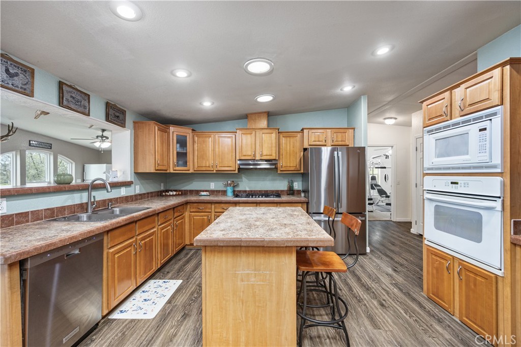 42100 Buckeye Street Caliente, CA 93518 - Photo 7 of 64 a kitchen with stainless steel appliances granite countertop sink stove refrigerator and cabinets
