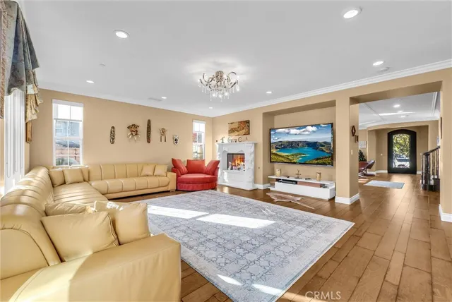 a kitchen with kitchen island granite countertop wooden floors granite counter tops and a window